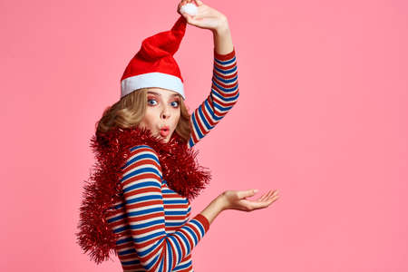 woman in a red cap with a sackcloth around her neck celebrate the New Year Christmasの写真素材