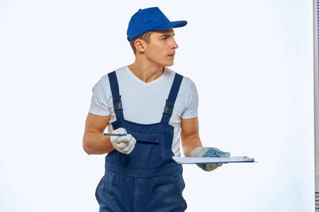 Working man in uniform documents delivery service courierの写真素材