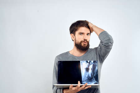 man holding laptop technology internet work communication light background