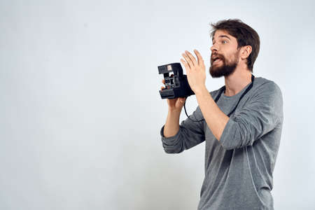 Male photographer professional camera work Studio Technology modern art light backgroundの写真素材