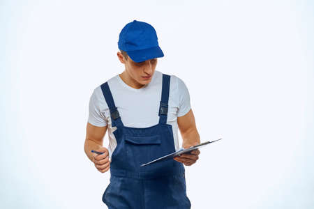 Working man in uniform documents delivery service courierの写真素材