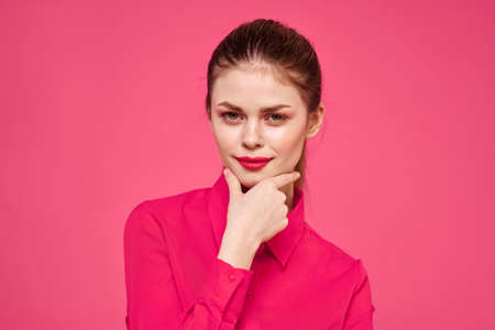 attractive girl in pink shirt cropped view bright makeup red lips gesturing with hands Copy Spaceの写真素材