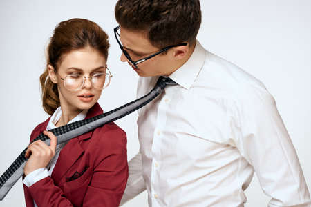 man and woman work colleagues officials communication light background