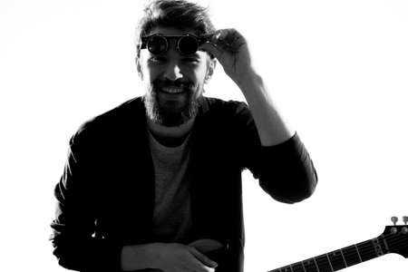Musician with guitar rock star emotions entertainment modern performerの写真素材