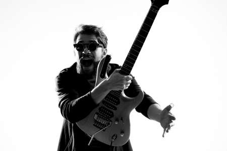 Male musician with guitar rock star performing entertainment programの写真素材