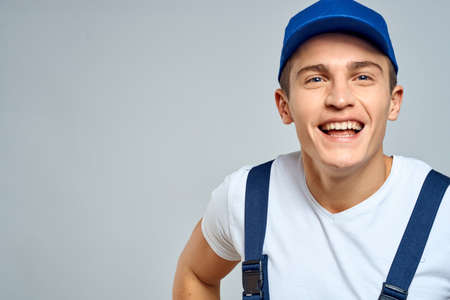 working man in uniform service lifestyle delivery service light backgroundの写真素材