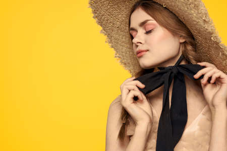 portrait of woman with red pigtails on yellow background cropped view emotion fun