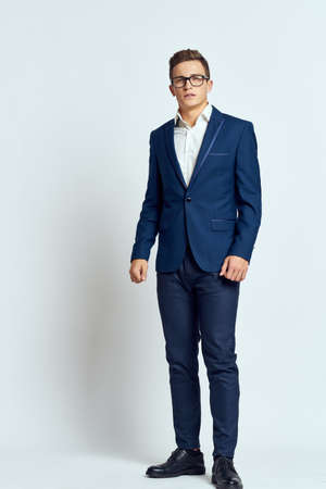 business man in suit wearing glasses self-confidence manager executive light backgroundの写真素材