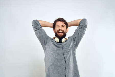 Man with headphones music lifestyle emotions technology modern style leisure entertainment light...