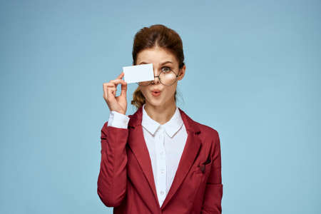 Business woman red jacket business card manager lifestyle blue background