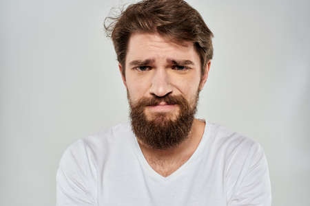 emotional bearded man close-up facial expression studio lifestyleの写真素材
