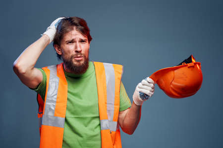 Emotional builder working uniform orange helmet safety Construction professionalの写真素材