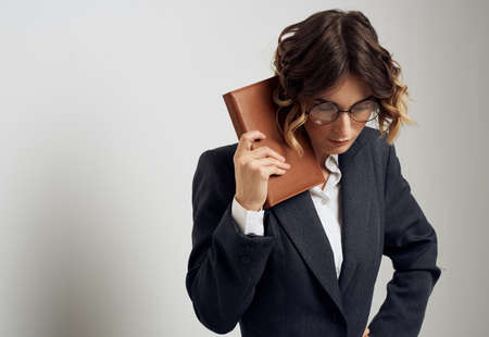 Woman with notepads jacket shirt model glasses hairstyle office