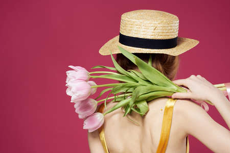 Beautiful woman with a bouquet of flowers a gift as an elegant style lifestyle