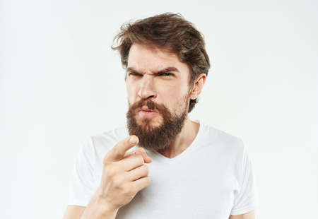 Man with beard in white t-shirt cropped view of emotion modelの写真素材