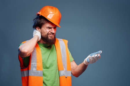 A bearded man in a builder in the form of emotions of a security Professional