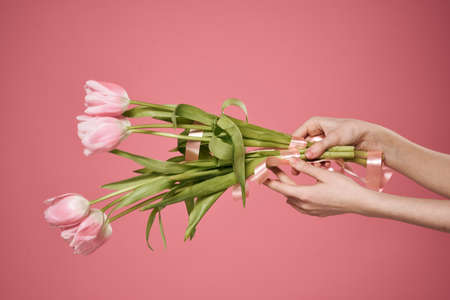 Bouquets of flowers gift holiday womens day pink backgroundの写真素材