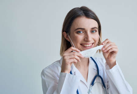 doctor in medical mask and coat health stethoscope