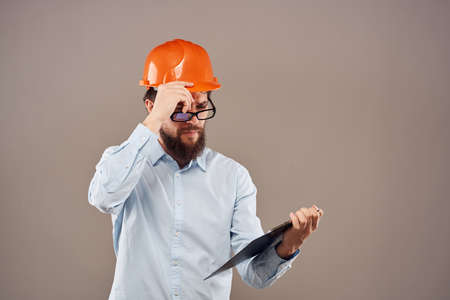 Business man in orange paint documents industry lifestyle beige background