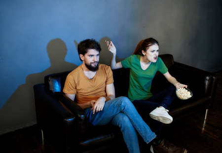 Couple watching horror movie.の写真素材