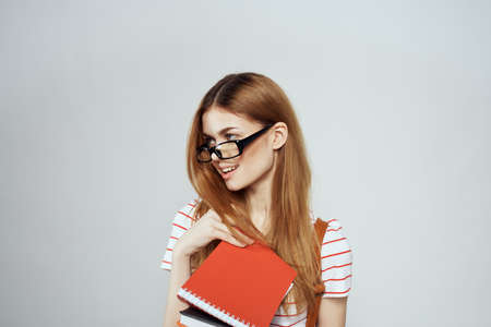 female student with notepad and backpack on back cropped view education science glassesの写真素材