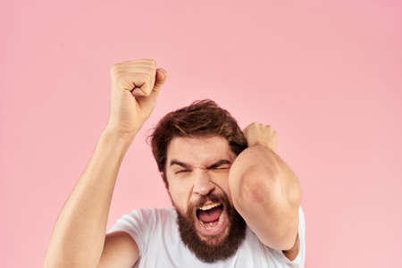 Bearded man white t-shirt cropped view lifestyle studio pink background