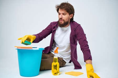 man washes floors at home interior professionals lifestyleの写真素材