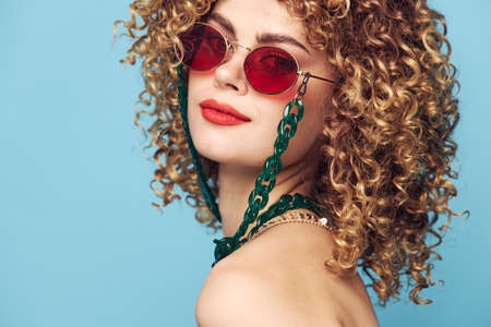 Beautiful woman Curly hair ornaments close-up bright makeup