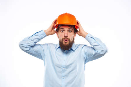 Man in working uniform orange hard hat lifestyle official