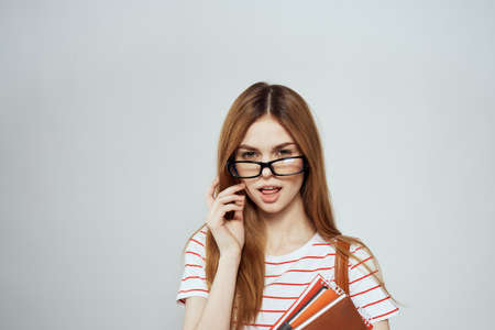 female student with notepad and backpack on back cropped view education science glassesの写真素材