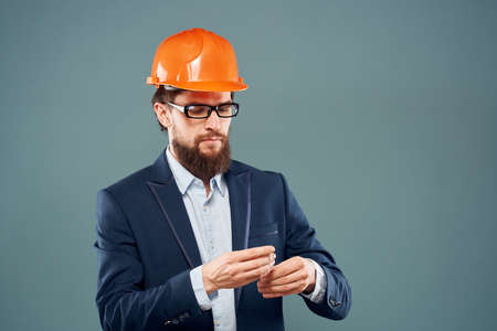 man in a suit in orange paint job business professional industry