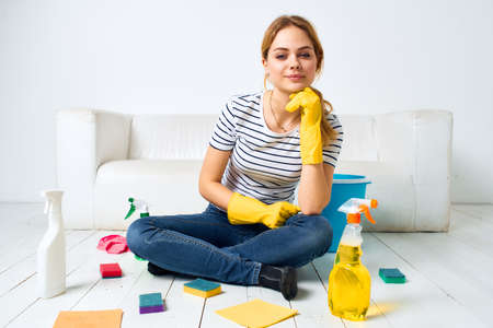 Cleaning lady at home detergent washing cooks lifestyleの写真素材