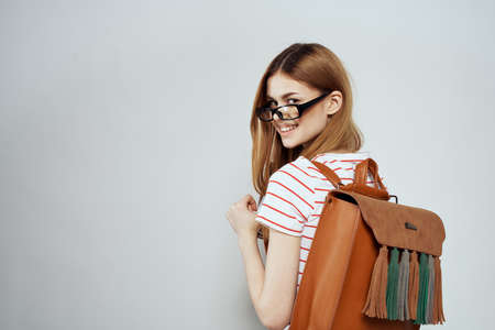 female student with notepad and backpack on back cropped view education science glassesの写真素材