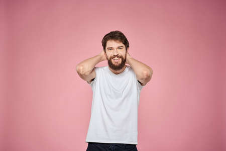 cute bearded men white t-shirt studio pink isolated backgroundの写真素材