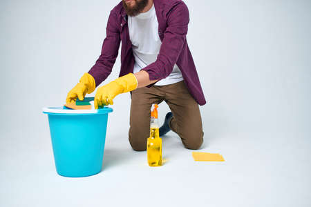 Cleaner on the floor with a blue bucket homework lifestyle professionalの写真素材