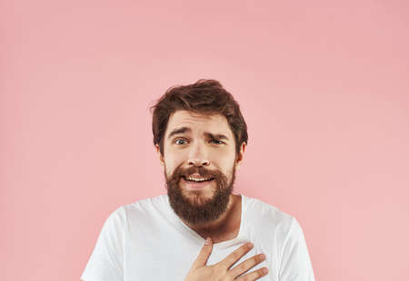 Man with beard and mustache white t-shirt pink backgroundの写真素材