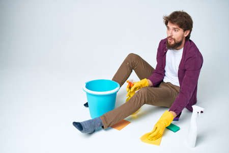 Man with detergent in the hands of a car wash providing housework hygiene servicesの写真素材