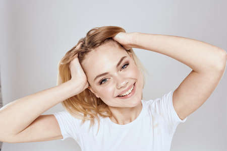 emotional blonde white t-shirt close-up studio lifestyle funの写真素材