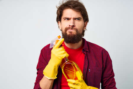 bearded man detergent rubber gloves rendering service cropped view professionalの写真素材