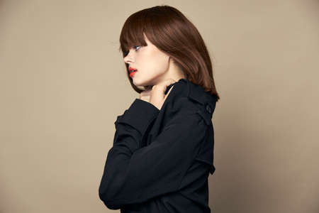 Attractive model classic coat smile laughing studio croppedの写真素材