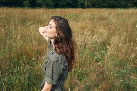 Woman walks in the clearing with her eyes closed fresh airの写真素材
