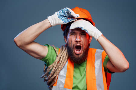 Screaming man cropped view of orange hard hat emotion professionalの写真素材