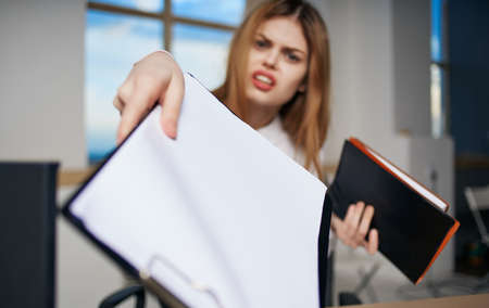 woman secretary in office at work desk documentsの写真素材