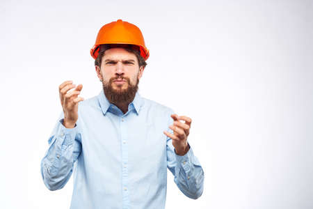Cheerful male orange hard hat safety professional construction engineer