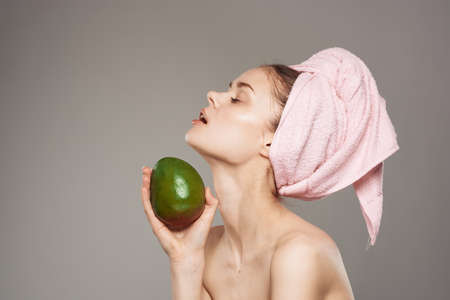 pretty woman with pink towel on head mango bare shoulders vitaminsの写真素材