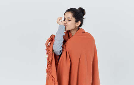 Portrait of a beautiful woman with an orange plaid on her shoulders health problems allergy napkin