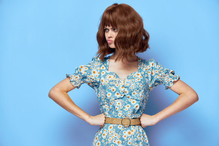 Woman in dress A disgruntled look at the hand on the belt short hairの写真素材