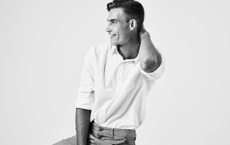photo of handsome man on light background cropped view