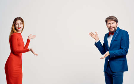 Woman in red dress or man in suit studio elegant style family lifestyle