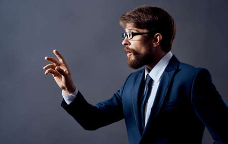 Man gestures with his hands in a classic suit glasses business finance Copy Space